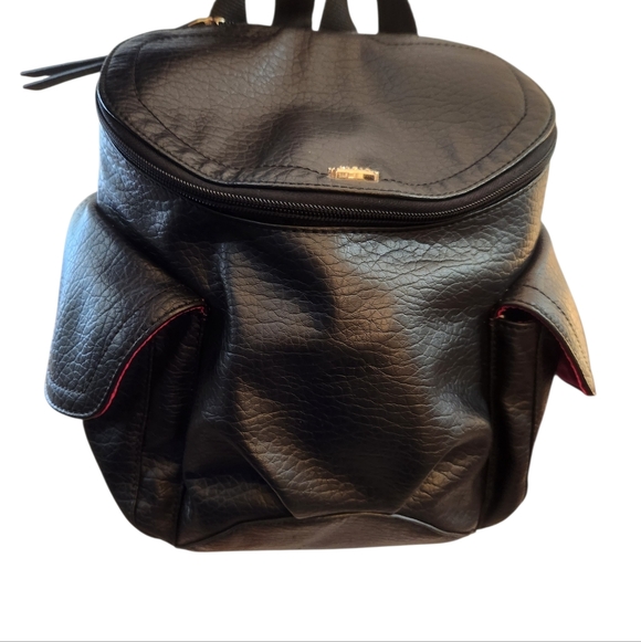 Juicy Couture Handbags - Vintage Juicy Couture Black Backpack With a Gold Crown Accent Pink Interior EUC